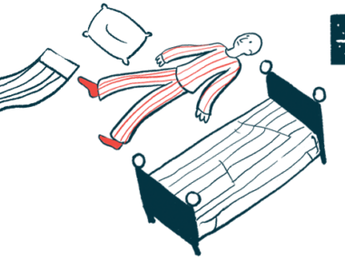 A person is seen lying awake on the floor at night time, between an empty bed and a pillow and a blanket, with the moon visible outside the window.