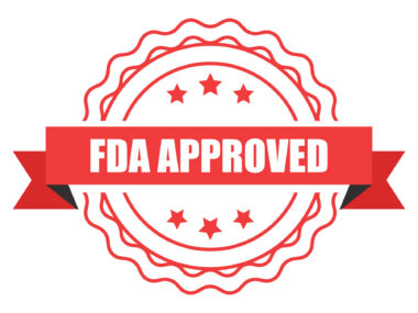 A red banner with the words FDA Approved written on it is pictured over a seal.