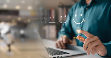 A person uses a laptop, with a customer satisfaction survey superimposed over the image.